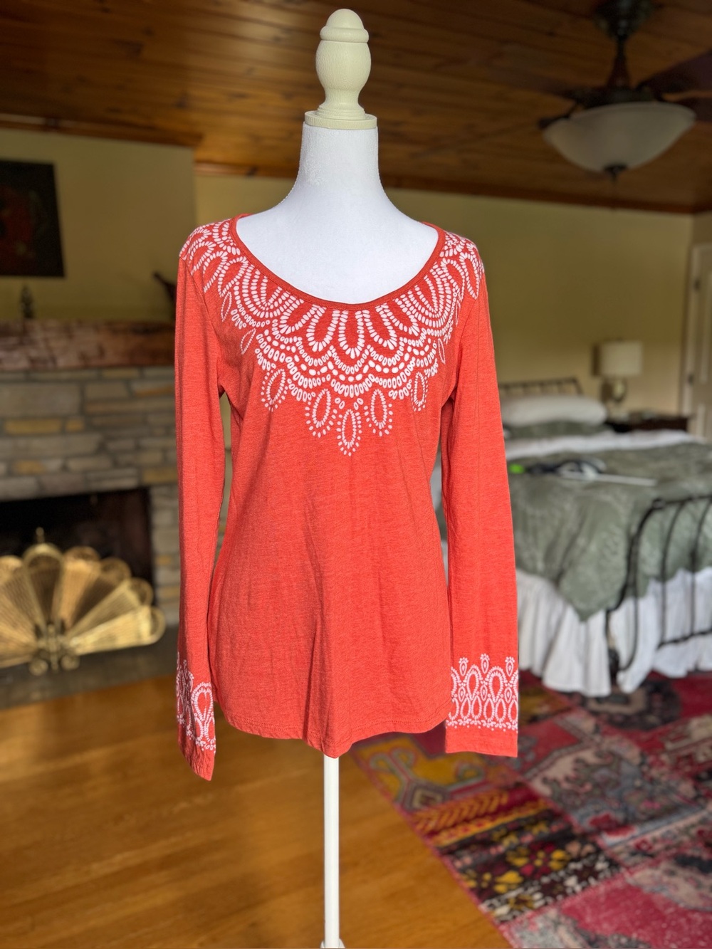 Prana Women's Coral Long-Sleeve Scoop Neck Top with white batik style design.